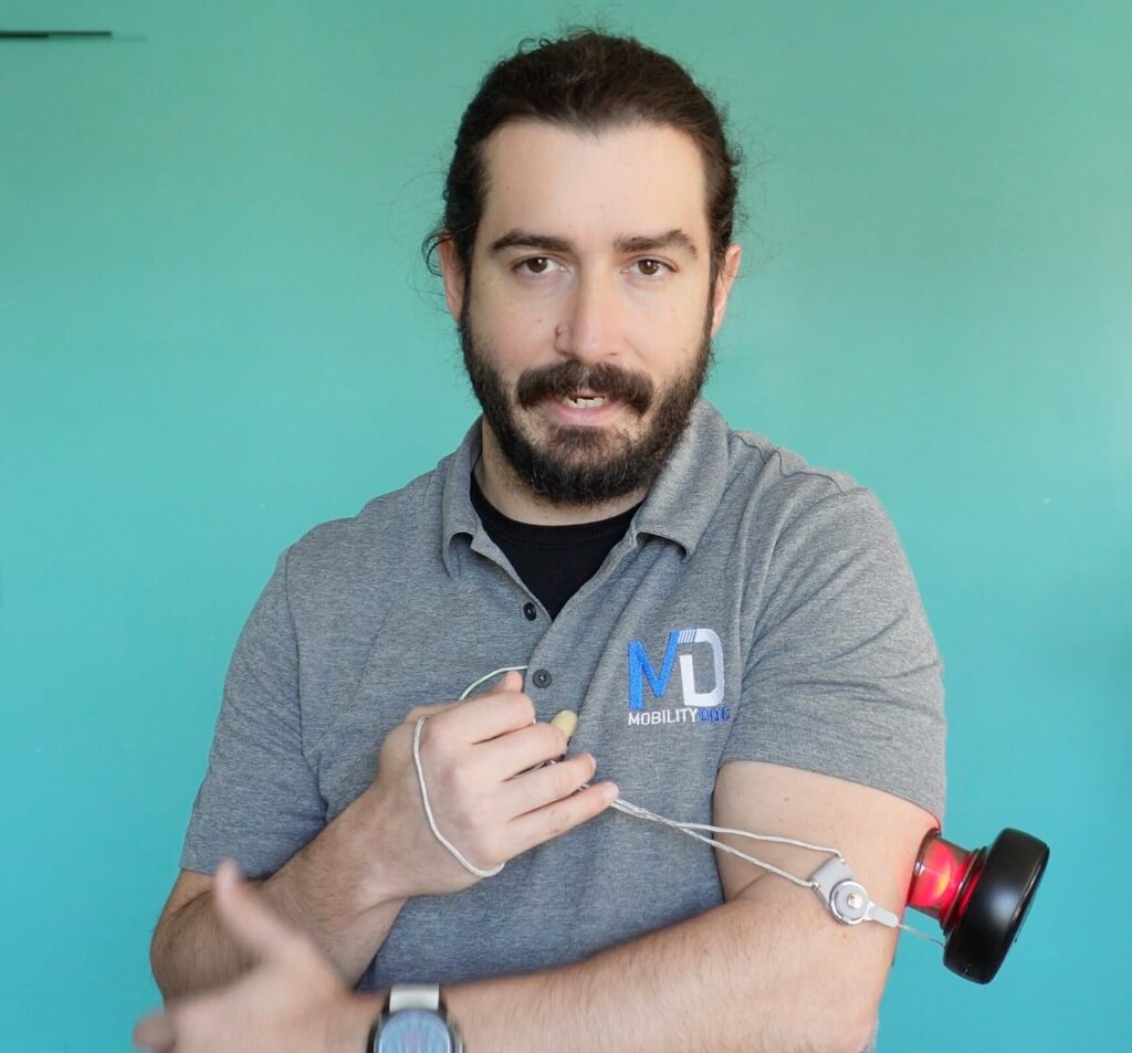 Dr. John applying the cup to the tricep and bending his elbow to add dynamic movmemnt